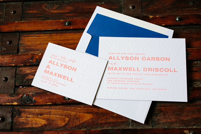 Ellipse is an ultra-modern wedding invitation design with blind debossed patterns on the front of the invitation cards, bold fonts and vibrant ink colors that pop against a bright blue envelope liner.